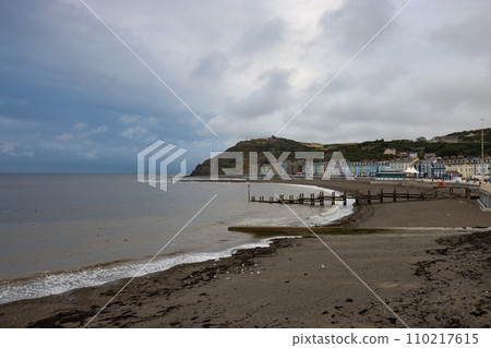 Aberystwyth is a seaside resort with a long promenade, and is situated on the Welsh coast. 110217615