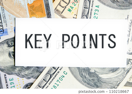 KEY POINTS text, a word written on a white business card against a background of money 110218667