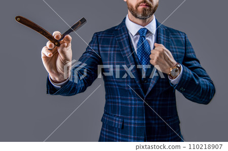 barber man with razor blade, selective focus. man with blade in barber studio. barber man with razor blade, selective focus. man with blade in barber studio. 110218907