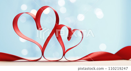 Hearts made from red ribbon. Valentine's card Hearts made from red ribbon. Valentine's card 110219247