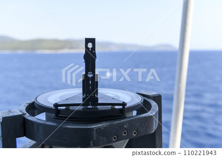 Azimuth ring on gyro compass. Direction finder on the navigational bridge. Azimuth vane. Bearing finder. Navigational equipment. 110221943