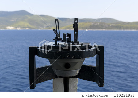 Azimuth ring on gyro compass. Direction finder on the navigational bridge. Azimuth vane. Bearing finder. Navigational equipment. 110221955