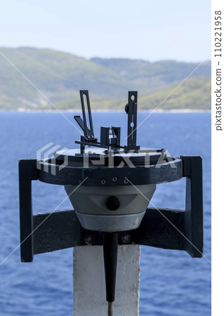 Azimuth ring on gyro compass. Direction finder on the navigational bridge. Azimuth vane. Bearing finder. Navigational equipment. Azimuth ring on gyro compass. Direction finder on the navigational bridge. Azimuth vane. Bearing finder. Navigational equipment. 110221958