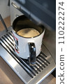 Coffee mug with coffee crema under the outlet of a fully automatic coffee machine 110222274