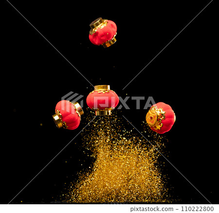 Gold Chinese Money lantern fly with dust particle in air. Chinese new year Yuanbao gold lantern floating to golden money sand particle. Language is wealthy prosperity. Black background isolated Gold Chinese Money lantern fly with dust particle in air. Chinese new year Yuanbao gold lantern floating to golden money sand particle. Language is wealthy prosperity. Black background isolated 110222800
