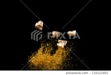 Gold Ingot Chinese Money bar token fly with dust particle in air. Chinese new year Yuanbao gold ingots floating to golden money sand particle. Language is wealthy prosperity. Black background isolated 110222801