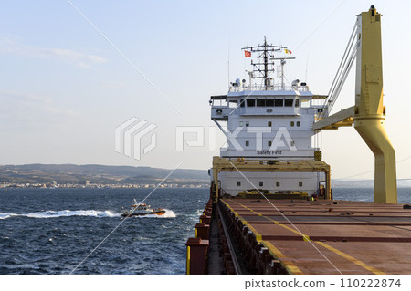 Pilot boat and cargo vessel at sea. Pilot embarkation. Pilotage. 110222874