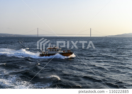Pilot boat and cargo vessel at sea. Pilot embarkation. Pilotage. 110222885