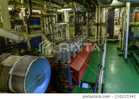 Main engine, Inside engine room on big ship, Marine engine on vessel. Main engine, Inside engine room on big ship, Marine engine on vessel. 110223342