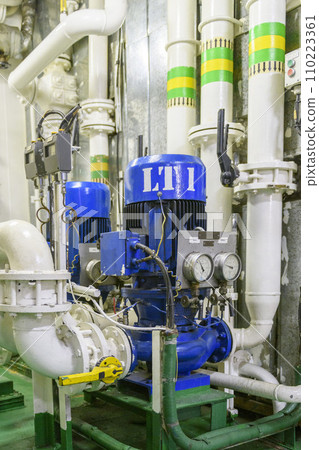 Water pump on ship. Engine room interior on big vessel. 110223361