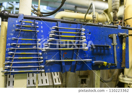 Instrument board on vessel. Spanners. Engine room interior. Instrument board on vessel. Spanners. Engine room interior. 110223362