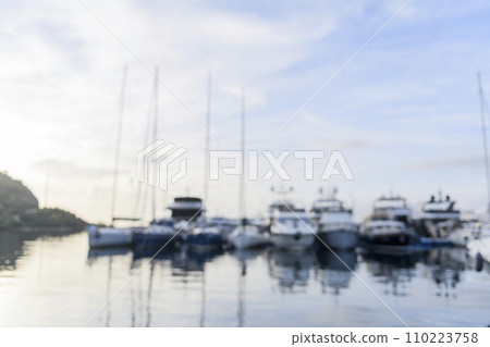 Blurred background sailing yachts in marina. Summer abstract defocused background. Yachting concept. Blurred background sailing yachts in marina. Summer abstract defocused background. Yachting concept. 110223758