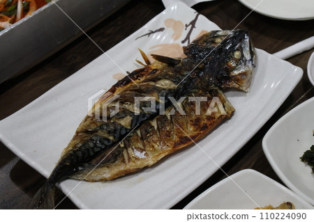 Korean food. Grilled mackerel on a plate Korean food. Grilled mackerel on a plate 110224090