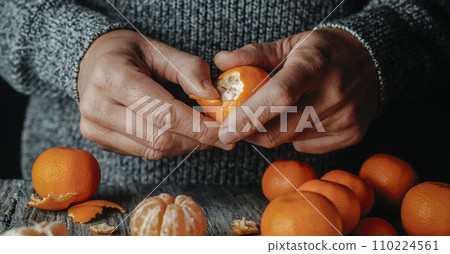 man peeling a tangerine, banner format 110224561