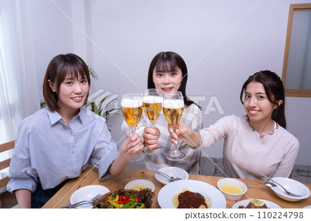 Three women toasting, girls' party Three women toasting, girls' party 110224798