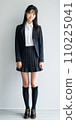 High school girl standing in front of school 110225041