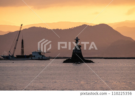 Early morning oyster raft landing in Hiroshima Bay and Itsukushima stone lantern Early morning oyster raft landing in Hiroshima Bay and Itsukushima stone lantern 110225356