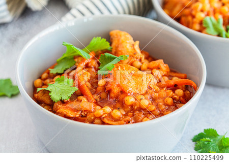 Ptitim stew with chicken and vegetables. Israeli traditional cuisine. 110225499