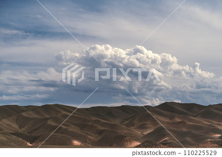 View of desert in Black Charyn Canyon in Kazakhstan in summer under cloudy sky View of desert in Black Charyn Canyon in Kazakhstan in summer under cloudy sky 110225529