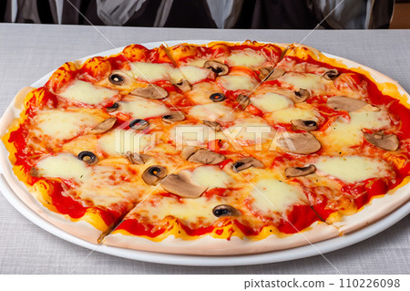 Pizza. Homemade pizza. Delicious pizza. Freshly made Italian margherita pizza with buffalo mozzarella and basil. Pizza with cheese, tomato sauce. Wood oven. World Pizza Day. February 9. 2024. 110226098