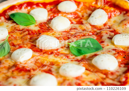 Pizza. Homemade pizza. Delicious pizza. Freshly made Italian margherita pizza with buffalo mozzarella and basil. Pizza with cheese, tomato sauce. Wood oven. World Pizza Day. February 9. 2024. Pizza. Homemade pizza. Delicious pizza. Freshly made Italian margherita pizza with buffalo mozzarella and basil. Pizza with cheese, tomato sauce. Wood oven. World Pizza Day. February 9. 2024. 110226109