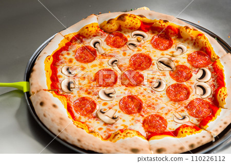 Pizza. Homemade pizza. Delicious pizza. Freshly made Italian margherita pizza with buffalo mozzarella and basil. Pizza with cheese, tomato sauce. Wood oven. World Pizza Day. February 9. 2024. 110226112