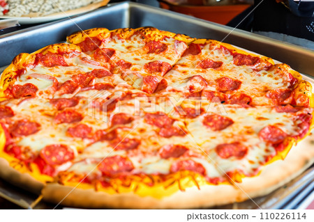 Pizza. Homemade pizza. Delicious pizza. Freshly made Italian margherita pizza with buffalo mozzarella and basil. Pizza with cheese, tomato sauce. Wood oven. World Pizza Day. February 9. 2024. 110226114