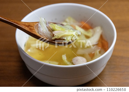 Consommé soup with vegetables and Vienna sausage Consommé soup with vegetables and Vienna sausage 110226658