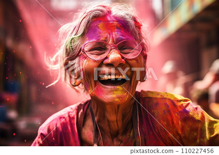 Portrait of old woman in colorful powder on indian street, Holi festival Portrait of old woman in colorful powder on indian street, Holi festival 110227456