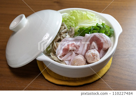 Hotpot food before heating in a small white clay pot Hotpot food before heating in a small white clay pot 110227484