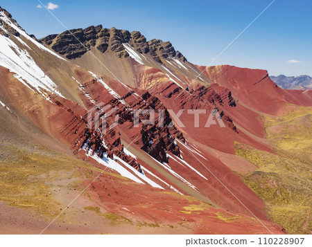 Stunning view of the Red Valley (valle rojo) with splashes of snow on the colored rocks, Cusco region, Peru 110228907