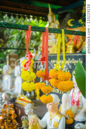 Buddhist religious offerings, Yellow marigold garland, in thailand temple 110229238