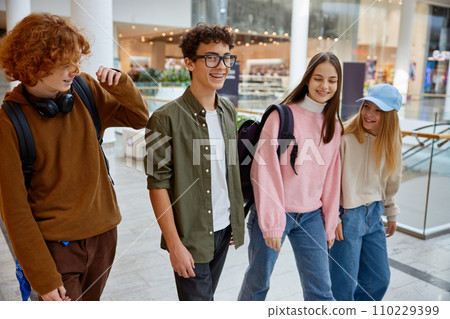 Happy group of diverse children walking in shopping mall Happy group of diverse children walking in shopping mall 110229399