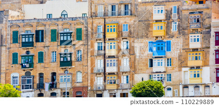 Valletta street with traditional colorful balconies Valletta street with traditional colorful balconies 110229889