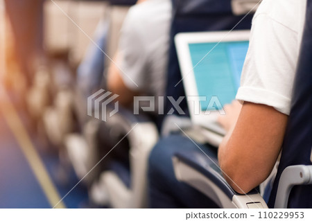 Man typing on a laptop 110229953