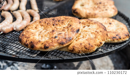 flapjacks with golden crust preparing on grill 110230172
