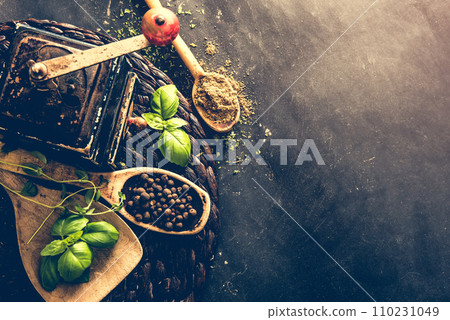 old mill and wooden spoons with spices old mill and wooden spoons with spices 110231049