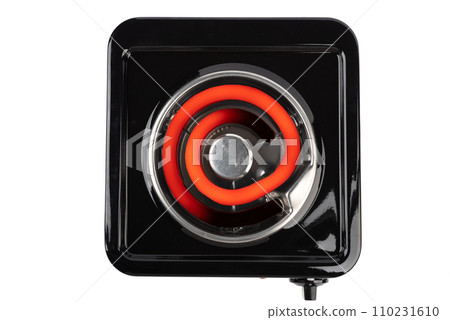 Top view of a tabletop electric stove with a hot heating element. 110231610