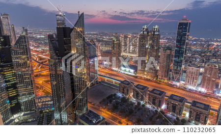 High-rise buildings on Sheikh Zayed Road in Dubai aerial day to night timelapse, UAE. 110232065