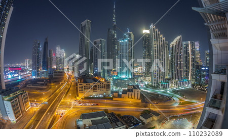 Aerial view of Dubai Downtown skyline with many towers night timelapse. Aerial view of Dubai Downtown skyline with many towers night timelapse. 110232089