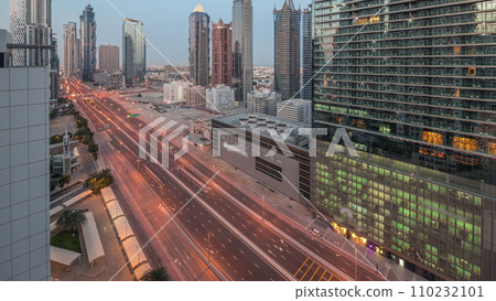 Business bay district skyline with modern architecture night to day timelapse from above. 110232101