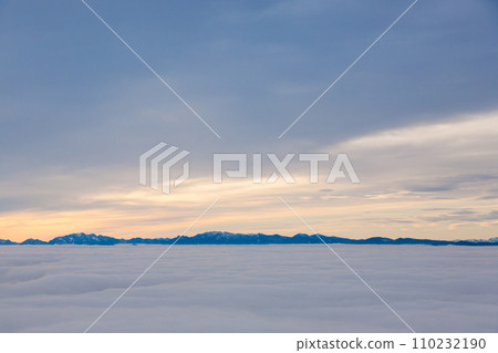 Mountain peaks emerging from the clouds Mountain peaks emerging from the clouds 110232190