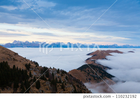 Mountain peaks emerging from the clouds Mountain peaks emerging from the clouds 110232192