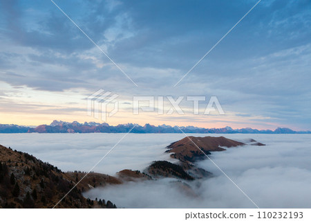 Mountain peaks emerging from the clouds Mountain peaks emerging from the clouds 110232193