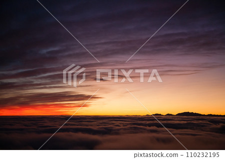 Spectacular sunset over a sea of clouds Spectacular sunset over a sea of clouds 110232195