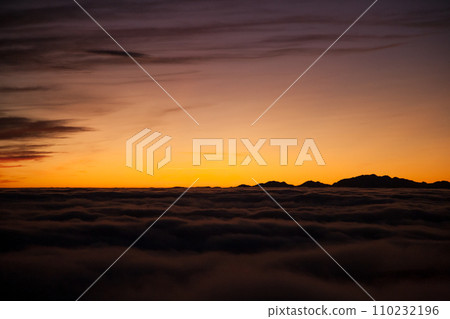 Spectacular sunset over a sea of clouds 110232196