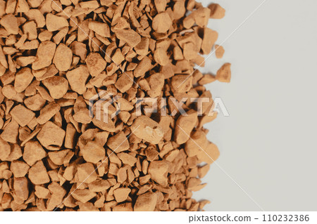 Background of freeze-dried granulated instant coffee macro close-up. Place for text on white Background of freeze-dried granulated instant coffee macro close-up. Place for text on white 110232386