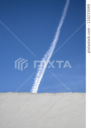 Typical white archtecture and blue sky with chemtrails Typical white archtecture and blue sky with chemtrails 110233049