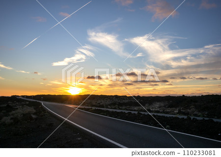 Road, lava field and a sunset, Lanzarote, Spain Road, lava field and a sunset, Lanzarote, Spain 110233081