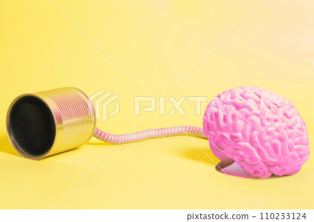 tin can phone with human brain anatomical model. communication concept 110233124